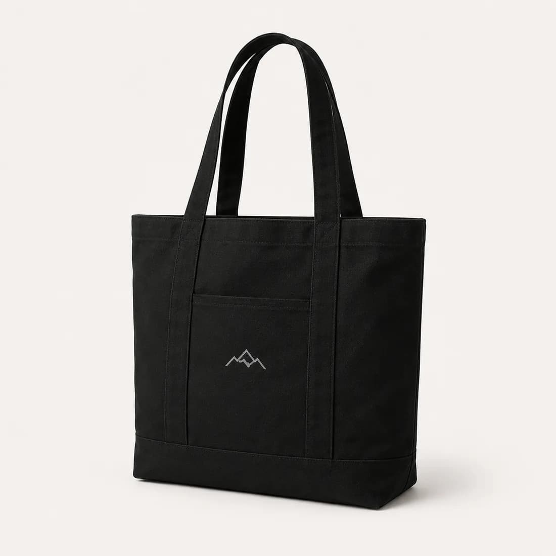 Black canvas tote bag with an embroidered logo